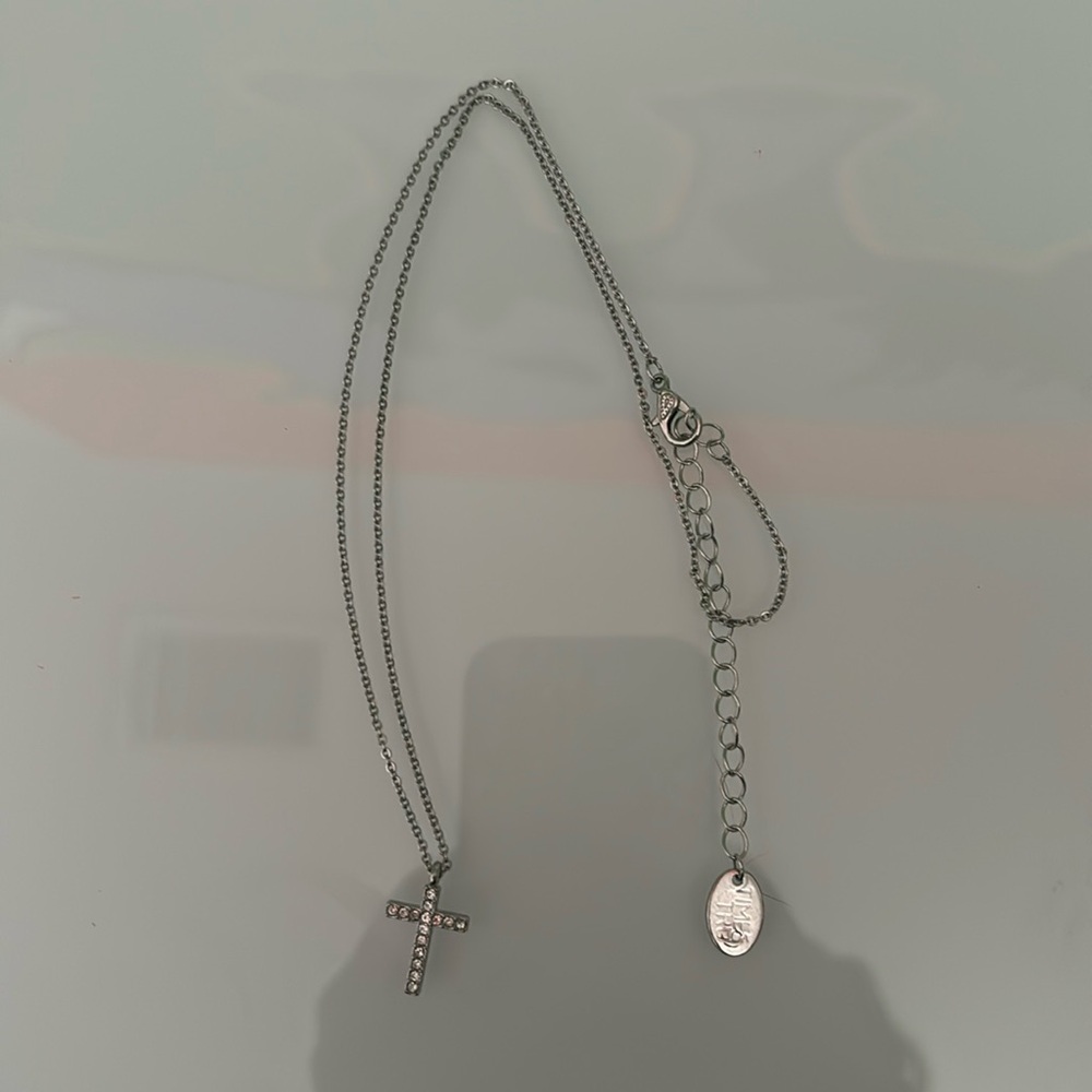 silver cross necklace.